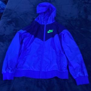 Blue and neon green Nike zip-up rain coat